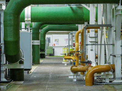 Utility building with visible and complex pipe systems.