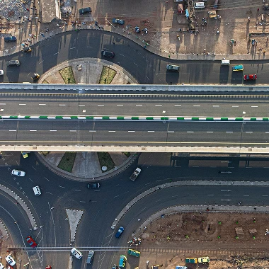 Aerial view of a bustling city street showcasing public-private partnership developments and urban infrastructure.