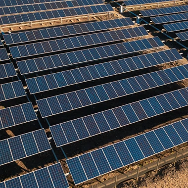 A large solar farm featuring rows of solar panels, harnessing energy from the sun for sustainable power generation.
